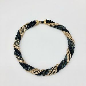 Necklace from beads rope gold, black and blue-iridescent . Length 18”